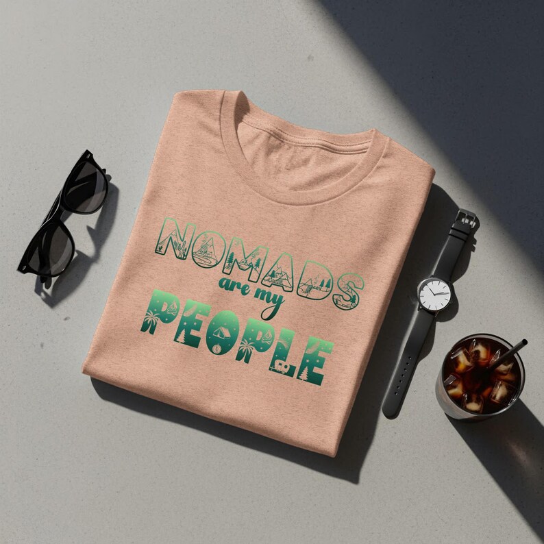 Peach t-shirt with "Nomads are my people" text and palm trees.