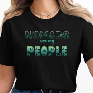 Black t-shirt with "NOMADS are my PEOPLE" text and camping icons.