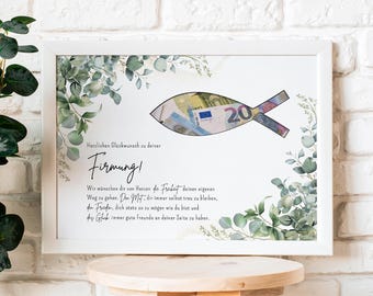 May include: A framed print with a white border, featuring a fish design made from a 20 Euro bill. The print includes text and is decorated with green and gray foliage. The print is displayed on a wooden stool.
