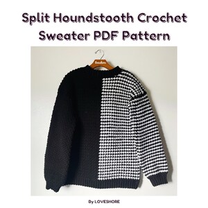 May include: A black and white crochet sweater with a houndstooth pattern on one side. The sweater is hanging on a wooden hanger with the word "loveshore" written on it. The sweater is a crochet pattern.