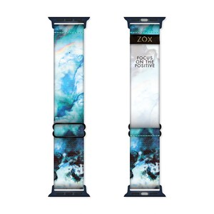 May include: A blue and white patterned Apple Watch band with a black buckle and the text "ZOX FOCUS ON THE POSITIVE" printed on the band.