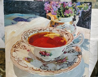 Russian lemon tea in Victorian cup with roses