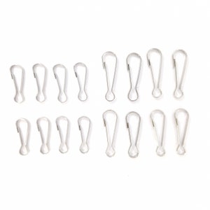 May include: A set of 18 silver metal swivel hooks. The hooks are arranged in two rows of nine.