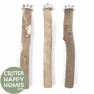 May include: Three wooden bird perches with metal attachments. The perches are different shapes and sizes. The perches are for small birds and are designed to be hung in a cage.