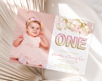 May include: Pink and gold first birthday party invitation with a photo of a baby girl wearing a pink dress and a flower crown. The invitation says "Amanda's is turning One!" and includes the date, time, and location of the party.
