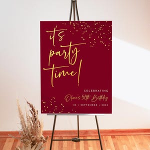 May include: A red welcome sign with gold confetti and the text "it's party time!"  Celebrating Olivia's 50th Birthday, 25 September 2025.