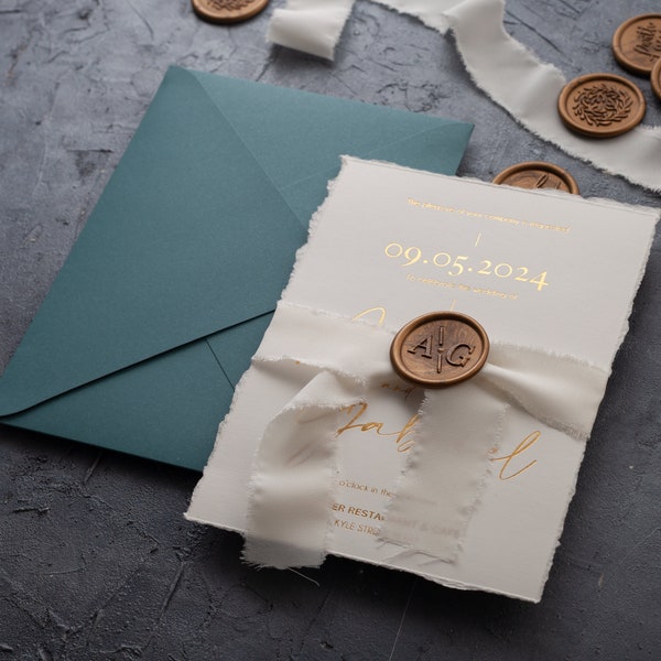 Wedding suite featuring deckled edge invitation, gold foil print, ribbon, custom wax & seal for ceremony and reception