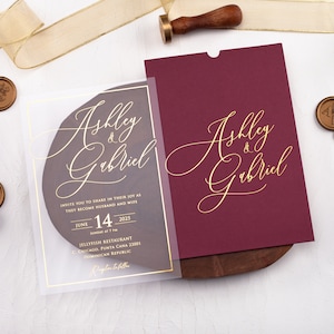 Customized acrylic wedding invitation in burgundy and gold, featuring elegant gold foil print