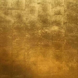 May include: A textured gold background with a subtle pattern of squares.