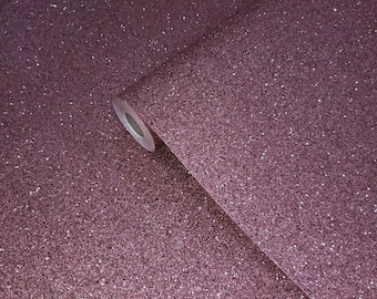 May include: A roll of pink glitter wallpaper with a subtle shimmer. The wallpaper is rolled up and the end of the roll is visible.