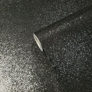 May include: A roll of black glitter wallpaper with a silver sparkle finish. The wallpaper is rolled up and the end of the roll is visible.