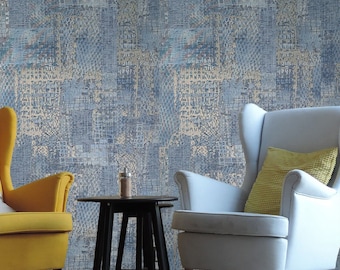 Papel pintado abstracto moderno con textura de tela sintética metálica en relieve azul, gris y dorado.