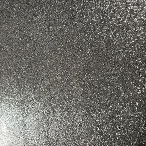 May include: A close-up of a textured, gray surface with a fine, sparkly finish.