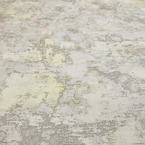 Carta da parati con texture in finto intonaco vintage in finta crema color oro marrone chiaro opaco immagine 5