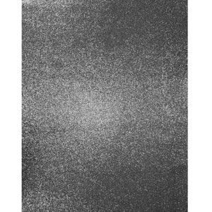 May include: A close-up of a textured, gray surface with a grainy, speckled pattern.