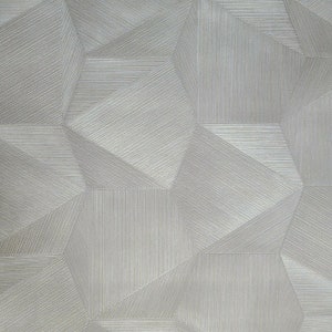 May include: A textured wallpaper with a geometric pattern of overlapping squares and rectangles in a light gray color.