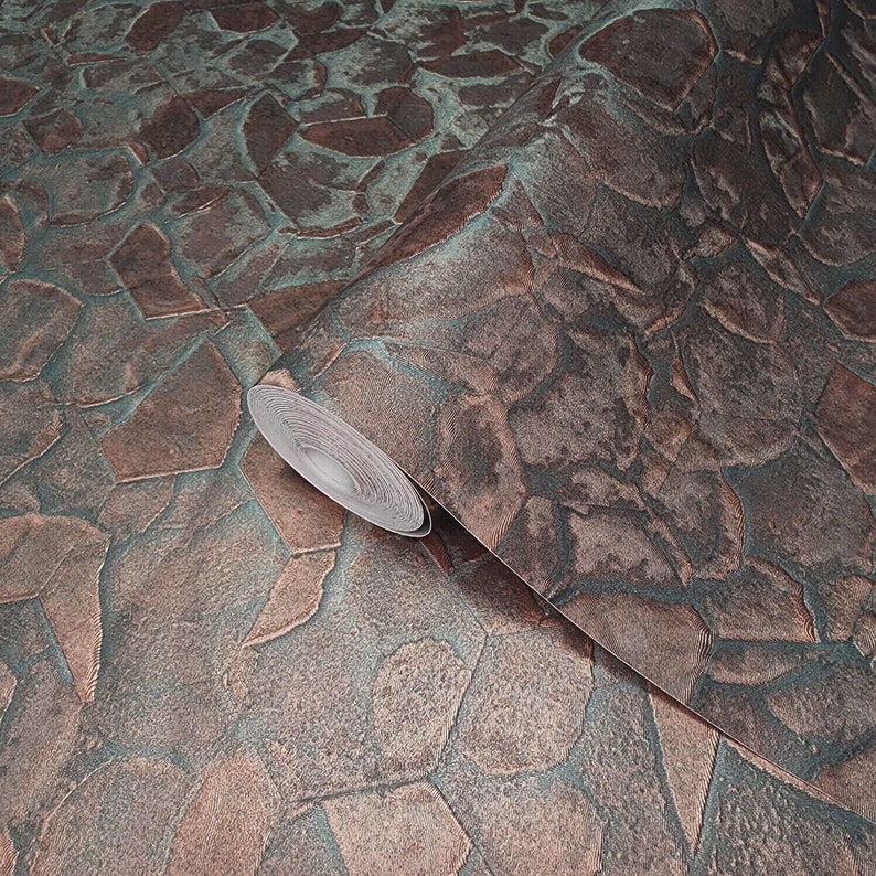 May include: A roll of wallpaper featuring a textured, stone-like pattern in shades of brown, copper, and teal.