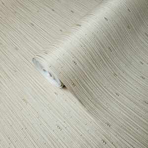 May include: A roll of beige wallpaper with a woven bamboo pattern. The wallpaper has a subtle sheen and a slightly textured surface.