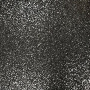 May include: A close-up of a black fabric with a sparkly, glittery texture.
