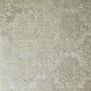 May include: A close-up of a textured, light gray background with a subtle, embossed damask pattern. The pattern is in a lighter shade of gray, creating a subtle contrast against the background.