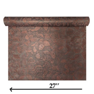May include: A roll of copper-coloured metallic wallpaper with a geometric pattern. The wallpaper is 27 inches (68.58 cm) wide.