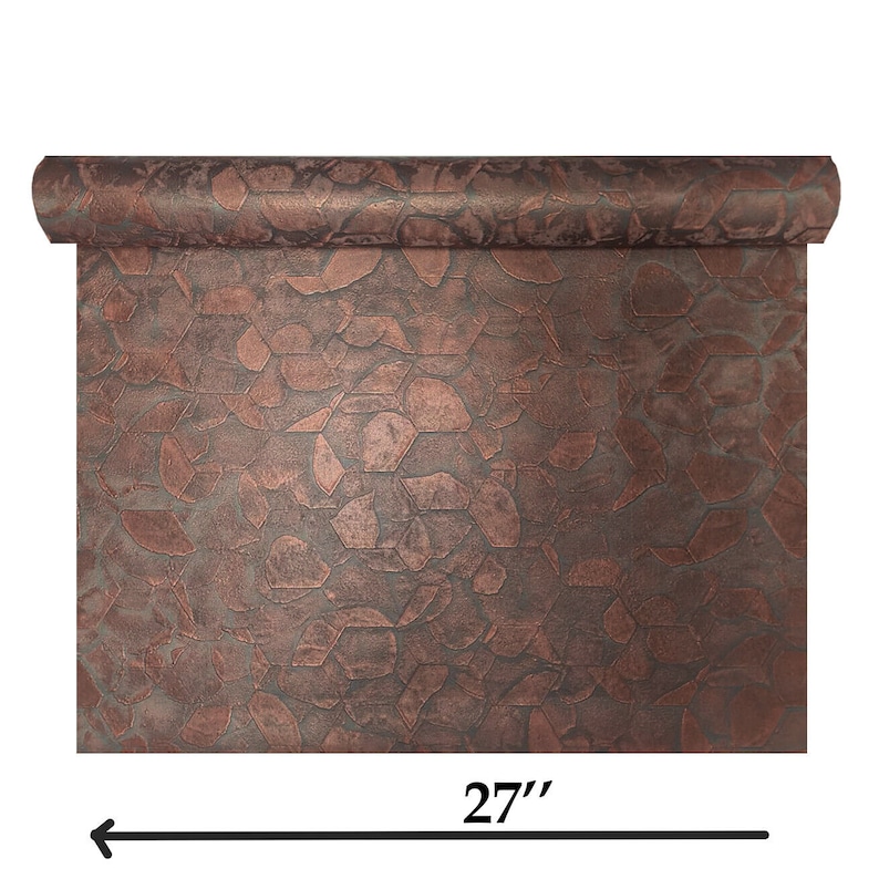 May include: A roll of copper-coloured metallic wallpaper with a geometric pattern. The wallpaper is 27 inches (68.58 cm) wide.