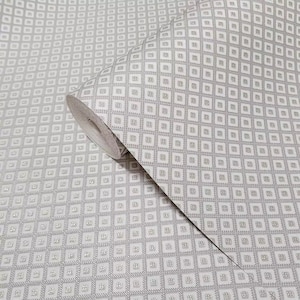 Embossed brass beige gold faux fabric textured diamond monogram modern Wallpaper