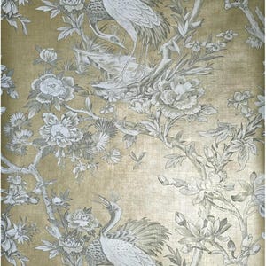 May include: Wallpaper with a gold background and a detailed floral and bird design. The pattern features white and gray cranes, flowers, and foliage. The design has a textured appearance.