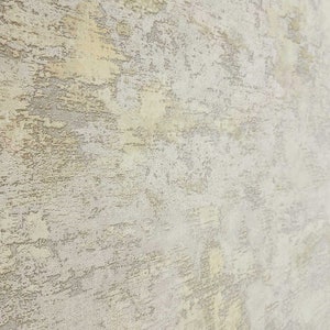 Carta da parati con texture in finto intonaco vintage in finta crema color oro marrone chiaro opaco immagine 10