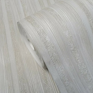 May include: A roll of silver and white textured wallpaper with a woodgrain pattern.