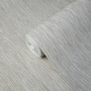 May include: A roll of light gray wallpaper with a subtle textured pattern that resembles woven linen. The wallpaper has a slightly shimmery finish.