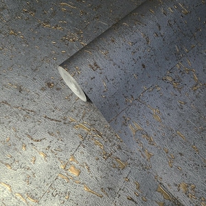 May include: A roll of textured wallpaper with a metallic silver and gold finish. The wallpaper has a distressed look with a subtle pattern of gold flecks.