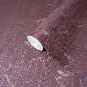 May include: A roll of burgundy wallpaper with a subtle gold shimmer and a textured linen-like finish.