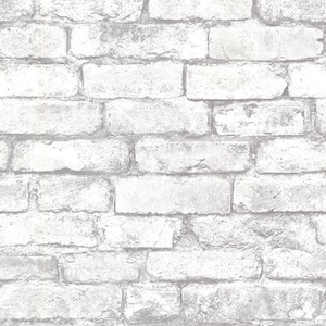 May include: White brick wallpaper with a distressed, aged look. The wallpaper has a realistic brick texture and is perfect for adding a touch of industrial chic to any room.
