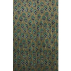 May include: A green and gold fabric with a repeating pattern of peacock feathers.
