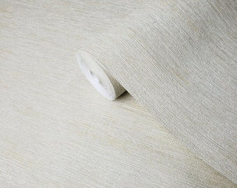 May include: A roll of beige wallpaper with a subtle textured pattern. The wallpaper has a slightly shimmery finish.