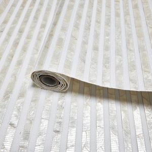 May include: A roll of textured wallpaper with vertical stripes. The design features alternating wide, off-white stripes and narrower, textured stripes with a subtle, shimmering effect. The paper is partially unrolled, revealing the core.