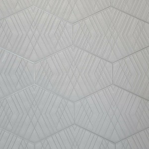 May include: A white wall with a geometric pattern of overlapping lines creating a hexagonal design.