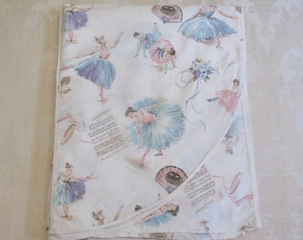 May include: White fabric with a repeating pattern of ballerinas in various poses. The ballerinas are wearing tutus in shades of blue, pink, and purple. The fabric has a vintage feel and would be perfect for a craft project or to use as a tablecloth.