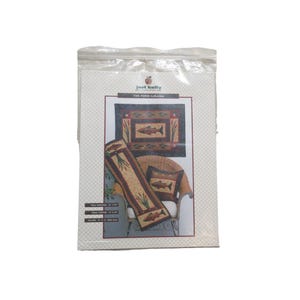 May include: A package featuring a home decor set from "The Pond Collection." The set includes a rug, a table runner, and a pillow, all with a fish and aquatic plant design. The color palette includes shades of brown, beige, and green.