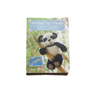 May include: A book cover featuring a knitted panda bear clinging to bamboo stalks. The title "Knitted Toy Travels" is displayed above the panda, with the author's name, Laura Long, at the bottom. The cover has a light green and brown color scheme.