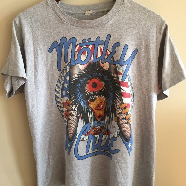 A 1987 vintage motely crue "girls girls girls" tee shirt by tyler. screen stars.