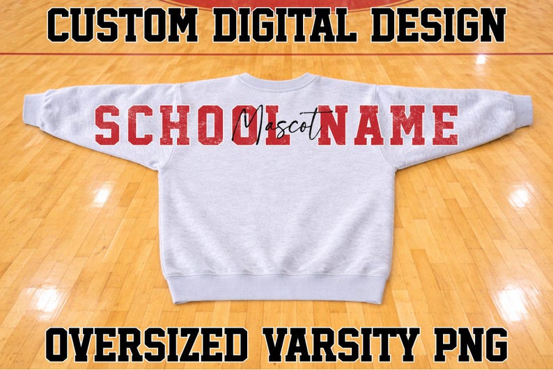 May include: A light grey long-sleeve sweatshirt featuring the red text SCHOOL MASCOT NAME across the back. The word SCHOOL is in a block font, the word Mascot is in a black script font, and the word NAME is in a red block font.
