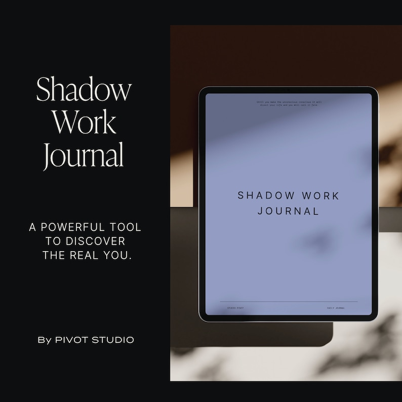 May include: A digital tablet displaying a blue screen with the text "Shadow Work Journal" on a white marble surface. The text "Shadow Work Journal" is also displayed in a larger font on the left side of the image.