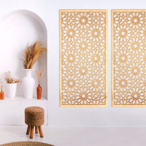 May include: Two wooden wall panels featuring a geometric design of interlacing circles and stars. The panels are light brown and have a natural wood finish.