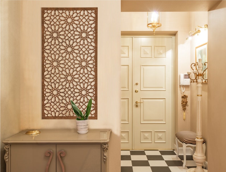 May include: A hallway with a white door, a decorative wooden wall panel, a small table with a plant, and a black and white chequered floor.