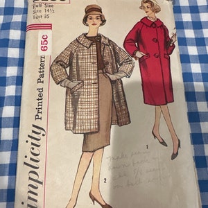 May include: Vintage Simplicity printed sewing pattern, size 14 1/2, bust 35. The pattern features illustrations of a woman in a plaid coat and a red coat. The pattern is labeled "Slenderette" and includes handwritten notes.