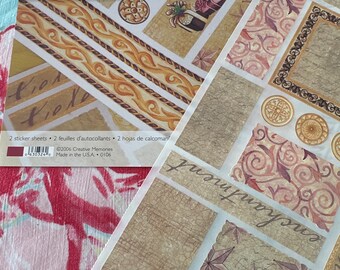 Puede incluir: Dos hojas de pegatinas decorativas con un diseño dorado y marrón. Las pegatinas están etiquetadas como "Jumbo Great Lengths Stickers Formal Affair" y "Jumbo Great Lengths Autocollants Réceptions Solennelles".