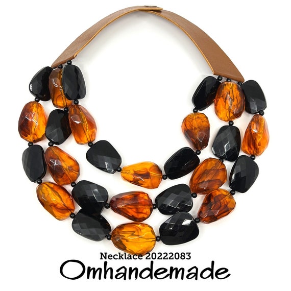 20222083 collana nera e nocciola, collana perline grosse, collana multifilo, collana bavaglino, collana grossa, collana bretelle in pelle