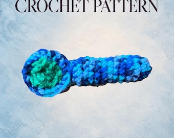 May include: A digital PDF crochet pattern featuring a blue and green crocheted pipe. The text 'DIGITAL PDF CROCHET PATTERN' is displayed at the top. The pipe has a round bowl with a green center and a long, textured blue handle.